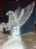 Snowfilled Fox 61 Logo in front of carved griffin