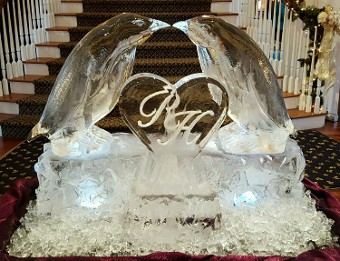 Ice Matters - Kissing Penguins on raised base with initials snowfilled on heart plaque in front