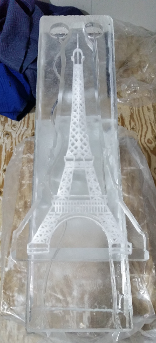 Eiffel Tower Logo frozen over double track shot luge