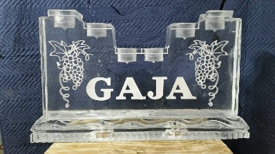 Snowfilled Grapes on each side of name with holes drilled in top for bottles