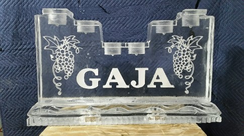 Snowfilled Grapes on each side of name with holes drilled in top for bottles