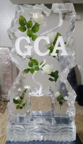 Flowers frozen into block with snowfilled letter, single pour luge, rocky edges