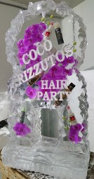 Flowers and hair products frozen into block for single pour drink luge - rocky