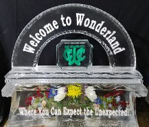 Waterbury Country Club logo colored with sand, silk flowers frozen into base, snowfilled wording