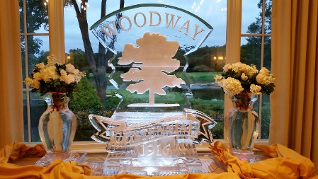 Vase on each side of logo with anniversary plaque