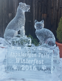 Carved Dog and Cat on Bases with Snowfilled Logo in Front