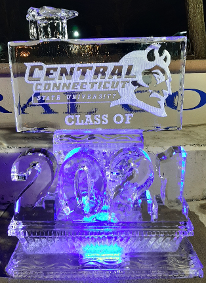 Ice Matters Carved Year in front of Snowfilled Logo with Graduation Cap