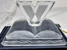 Snowfilled Wilton Library Logo in center of book