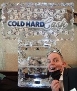 Laminated Cold Hard Cash logo frozen into block with money; hollowed base filled with money