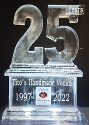 Large base with printed/laminated logo frozen into the block and snowfilled wording with a Carved 25th on top