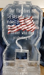 Laminated Picture of American Flag frozen into block with snowfilled wording in front