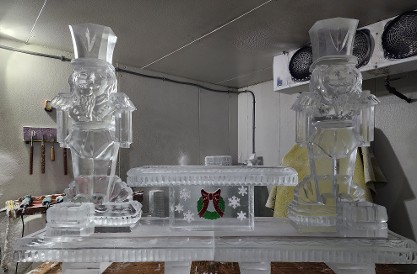 ice matters 80 inch base tray with nutcracker on each side of festive raised tray and two lemon holders