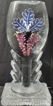 ice matters - wine glass facade with printed picture of logo and artificial grapes frozen into ice