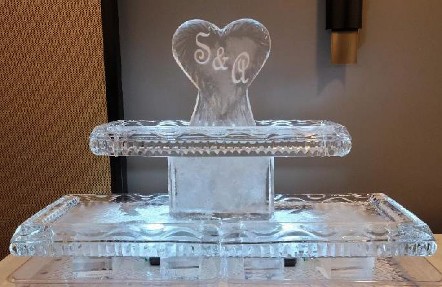 ice matters 54 inch based tray with carved heart with snowfilled initials on raised tray
