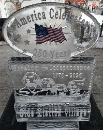 ice matters - picture of flag frozen into ice with snowfilled wording above and below - set on large base wtih snowfilled mount rushmore and plaque in front