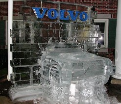 Car crashing through wall with colored VOLVO logo