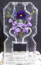 Silk Flowers frozen into block of double pour drink luge with detailed edges