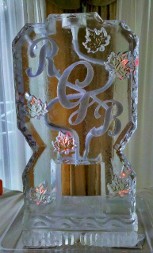 Snowfilled leaf outlines and snowfilled initials on double pour drink luge