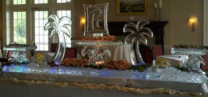 14 foot table top raw bar with logo on raised tray, palm trees and raised side trays